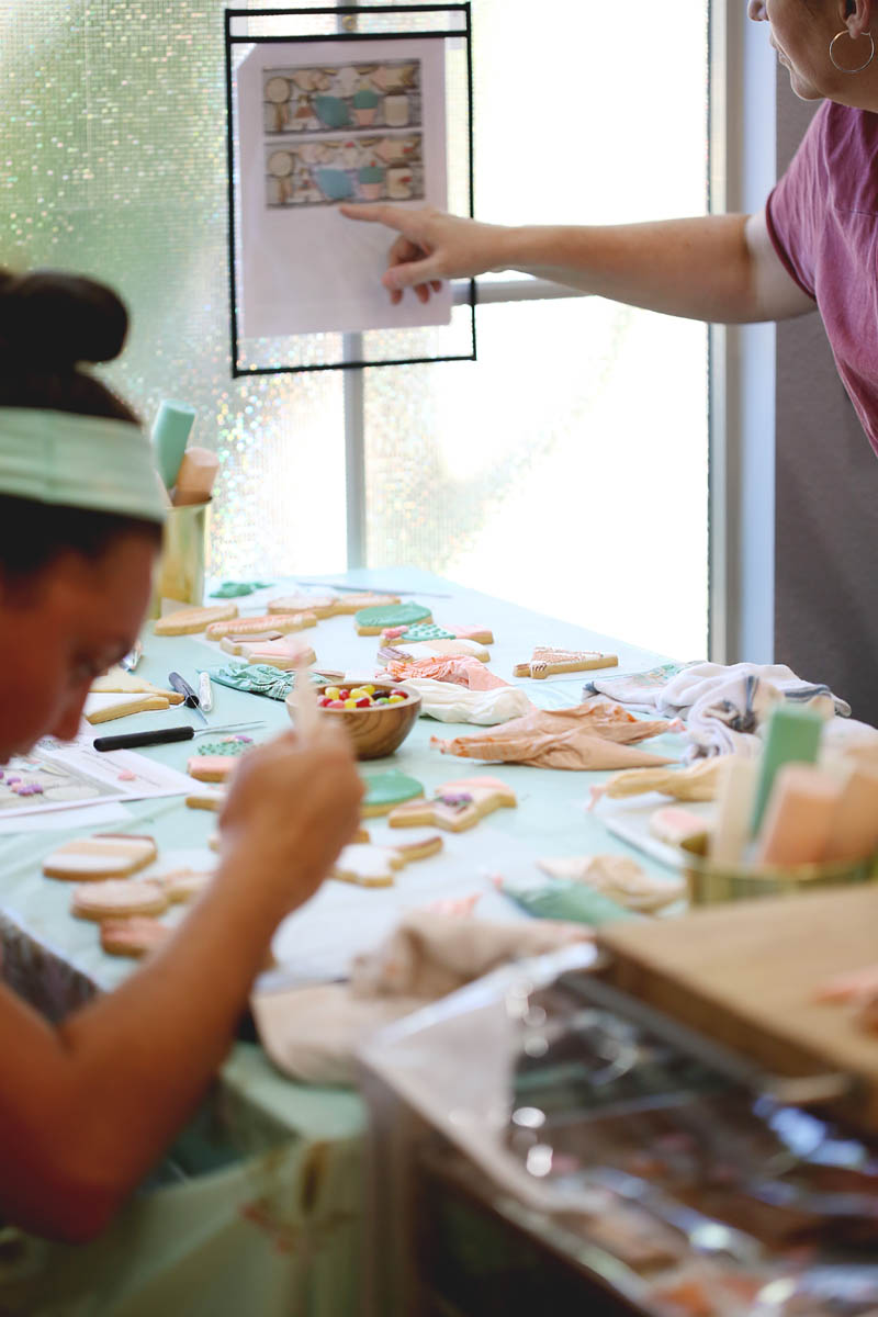 students learning how to decorate cookies