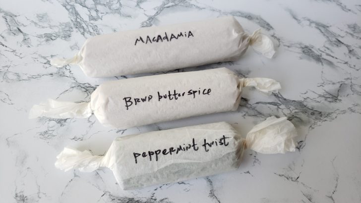 3 logs of slice-and-bake cookies wrapped in parchment paper.
