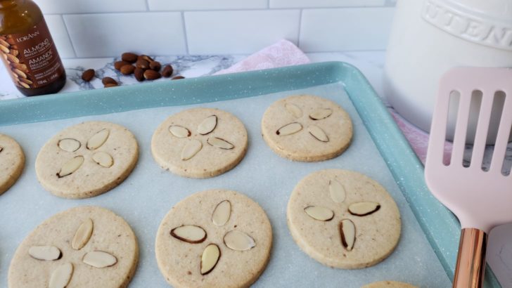 Almond shortbread sugar cookies on a cookie sheet. 