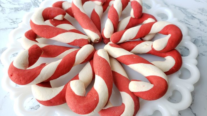 Close up of candy cane twist cookies arranged on a plate.