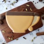 Masala chai shortbread sugar cookie decorated to look like a brown tea cup