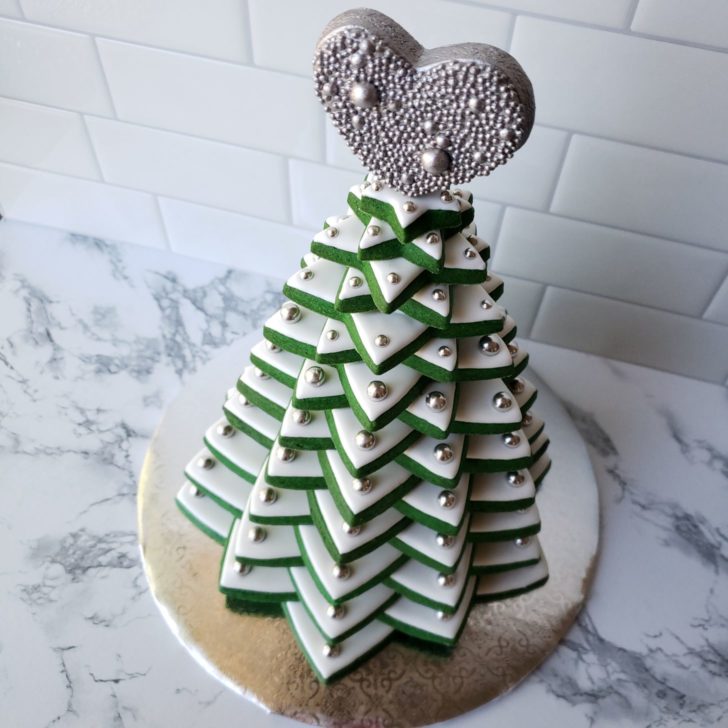 A Christmas tree made out of stacked star-shaped cookies.