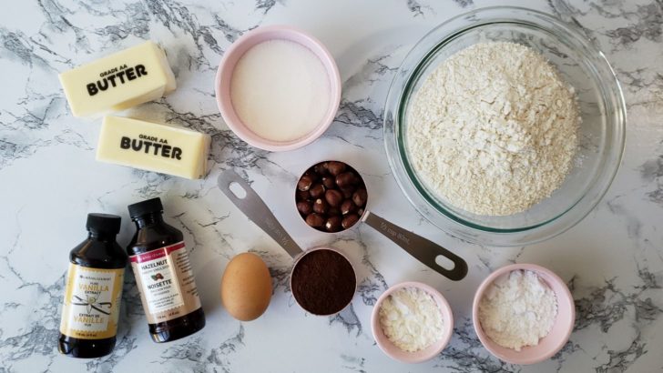 Overhead view of the ingredients for chocolate hazelnut shortbread sugar cookies. 