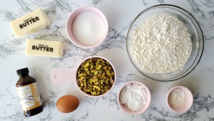 Overhead view of ingredients for pistachio shortbread sugar cookies. 