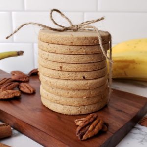 A stack of banana bread shortbread sugar cookies tied with twine.