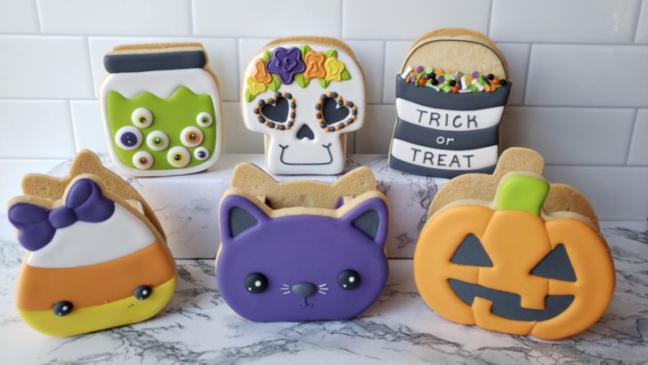 Halloween treat boxes made from decorated cookies.