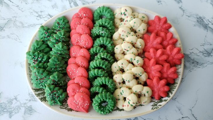 Green, red, and white Christmas spritz cookies on a platter